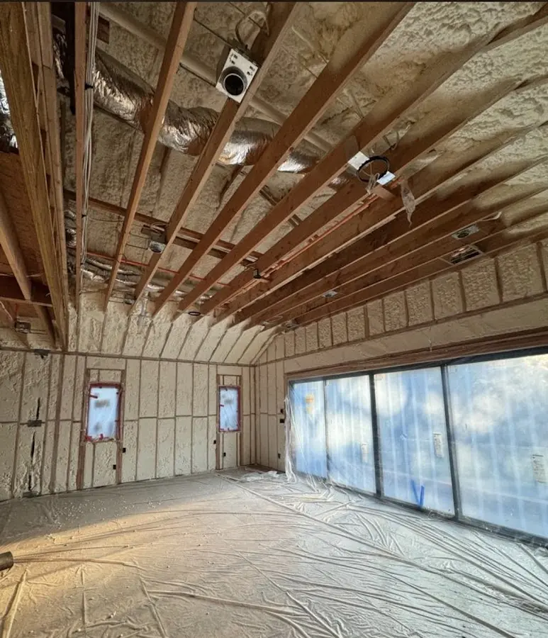 Interior walls and ceiling insulated with spray foam during new construction in Mercer Island